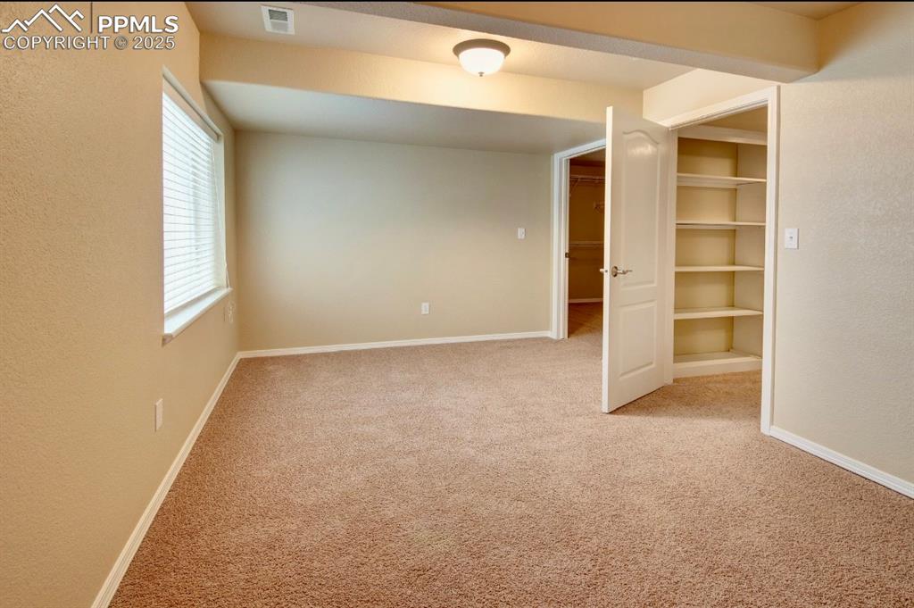 Image 39 of 42: Lower level bedroom