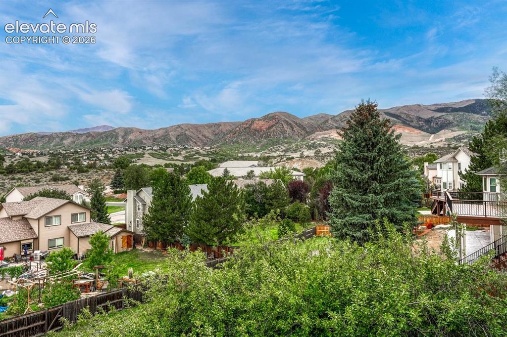 Image 35 of 41: Expansive mountain backdrop with surrounding residential properties