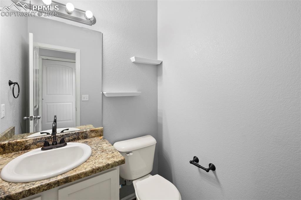 Image 14 of 38: Main level bathroom