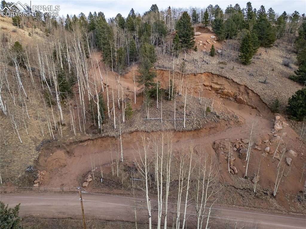 Image 12 of 12: Looking at property from main road, below, Granite Ln.