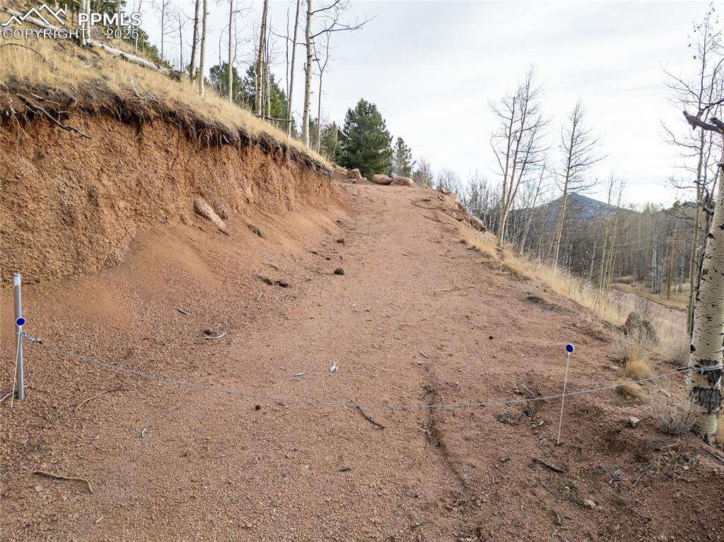 Image 6 of 12: View of first stretch of private road up side of mountain