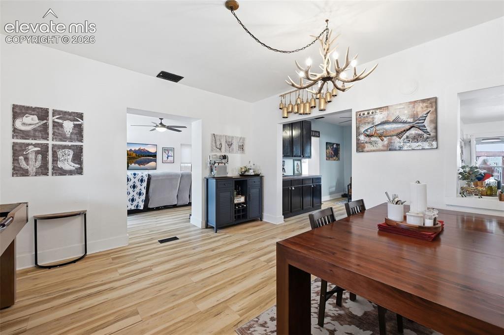 Image 10 of 50: This large dining area, bar and open kitchen
offers great flow.