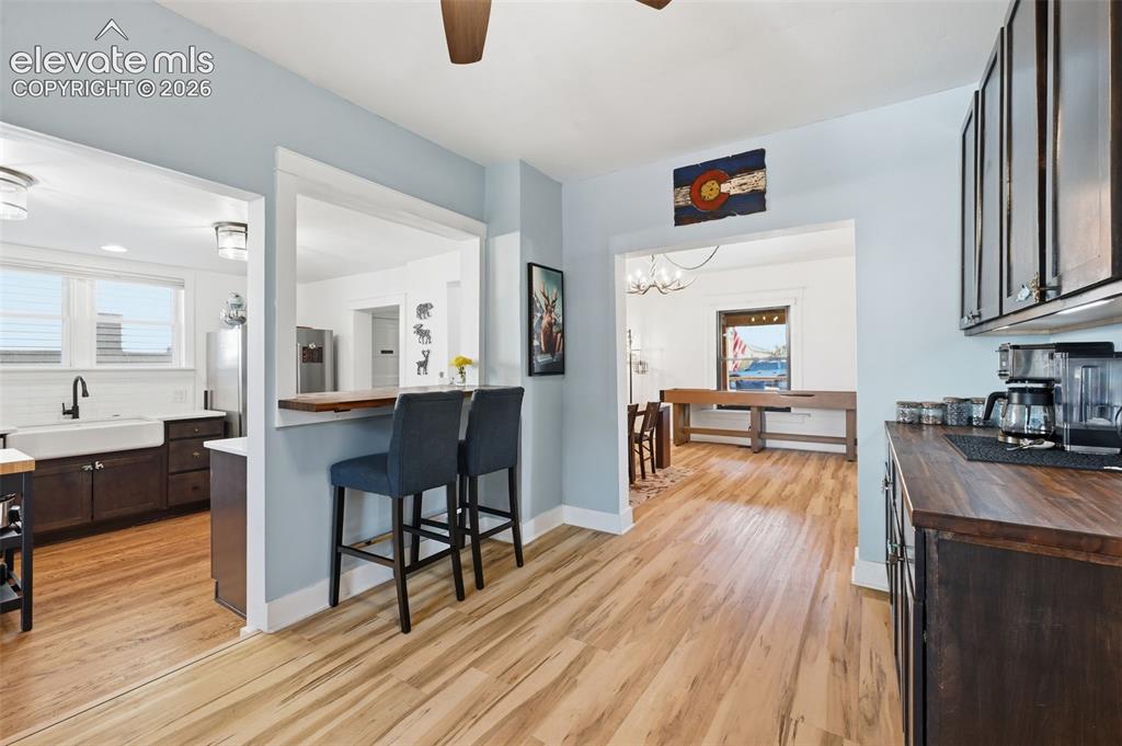 Image 15 of 50: An opening between
the kitchen and bar
offer a great breakfast bar and cr
