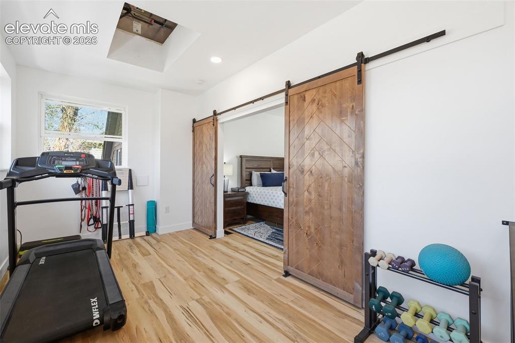 Image 18 of 50: Primary suite starts
with a flex space,
perfect for an office,
sitting a