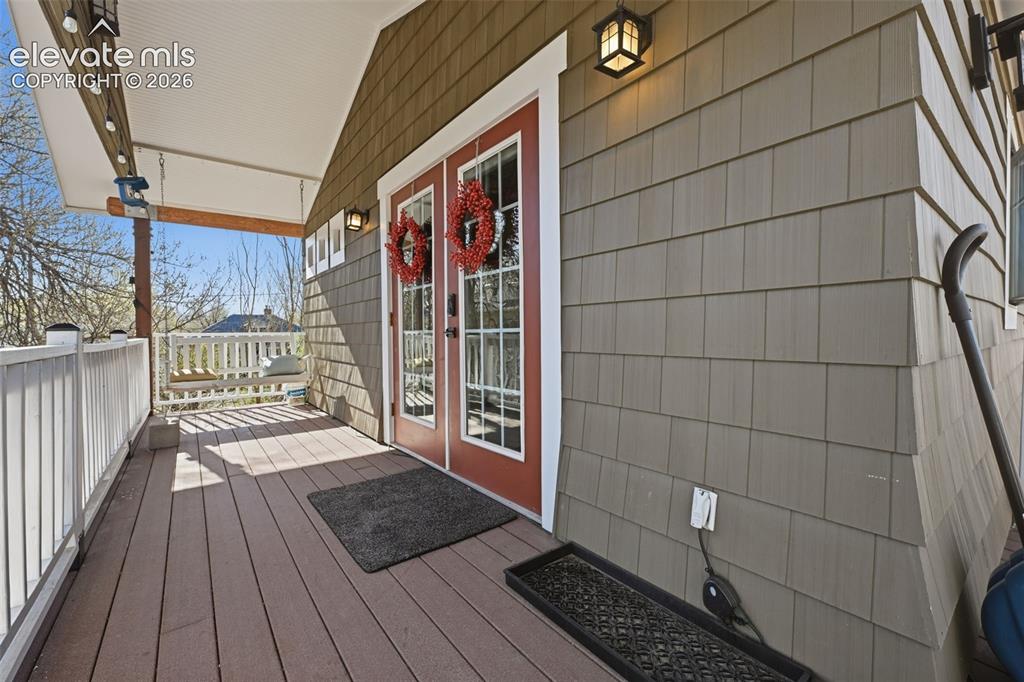 Image 36 of 50: Cottage Apartment -
wrapping deck and
inviting French doors.
