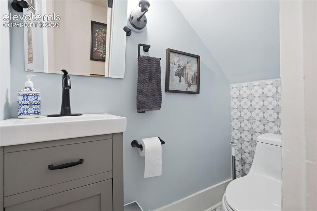 Image 7 of 50: Main level powder
bathroom conveniently
located off the main
hallway.
