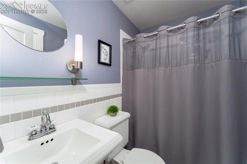 Image 9 of 27: upstairs full bath