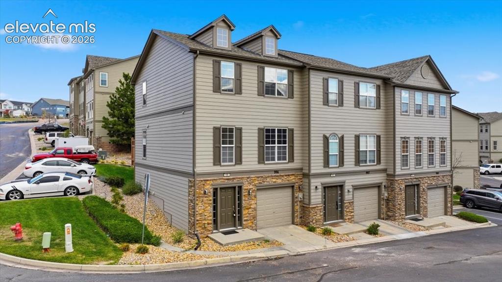 Image 1 of 34: Welcome home! 3-story townhome with parking, storage, and mountain views
