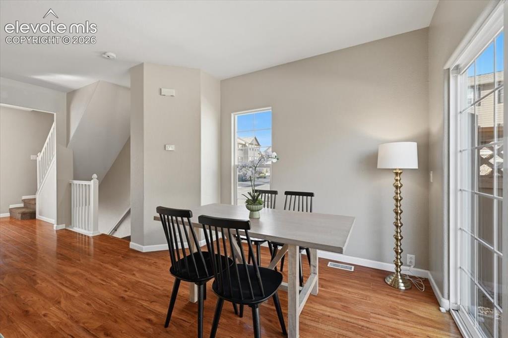 Image 11 of 34: Hardwood flooring throughout, providing a bright and airy atmosphere