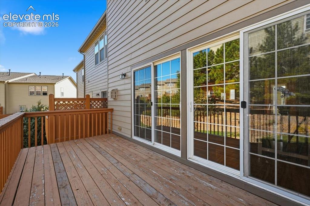 Image 29 of 34: Wood deck with railing and lattice detailing