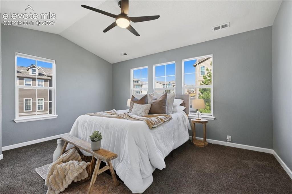 Image 4 of 34: Large Primary with ensuite bathroom. Large windows and great natural light