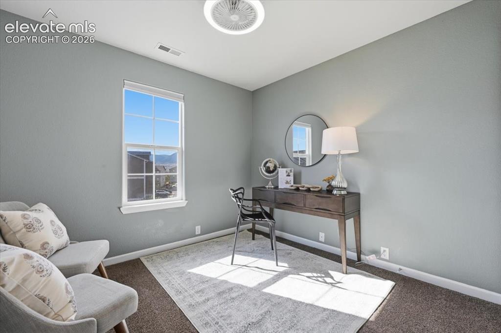 Image 5 of 34: Light and bright room with window showcasing mountain views