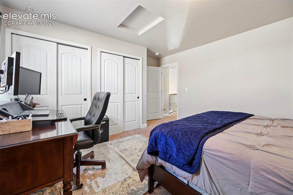 Image 28 of 47: Recessed ceiling feature, white sliding closet doors, ceiling light fixture