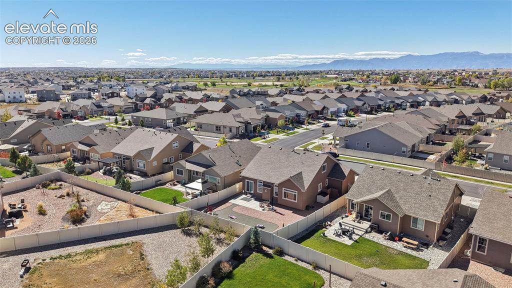 Image 38 of 46: Aerial perspective of the residential property featuring a paver patio, fen