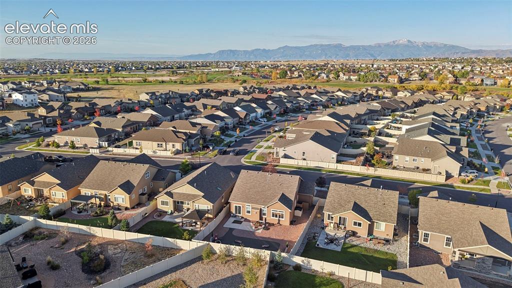 Image 42 of 47: Expansive suburban neighborhood with mountain scenery