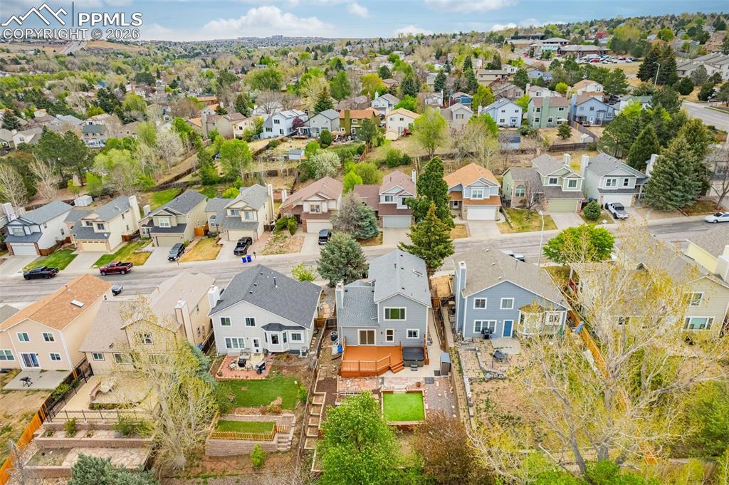 Image 34 of 41: Expansive aerial view showcasing a residential neighborhood with varied arc