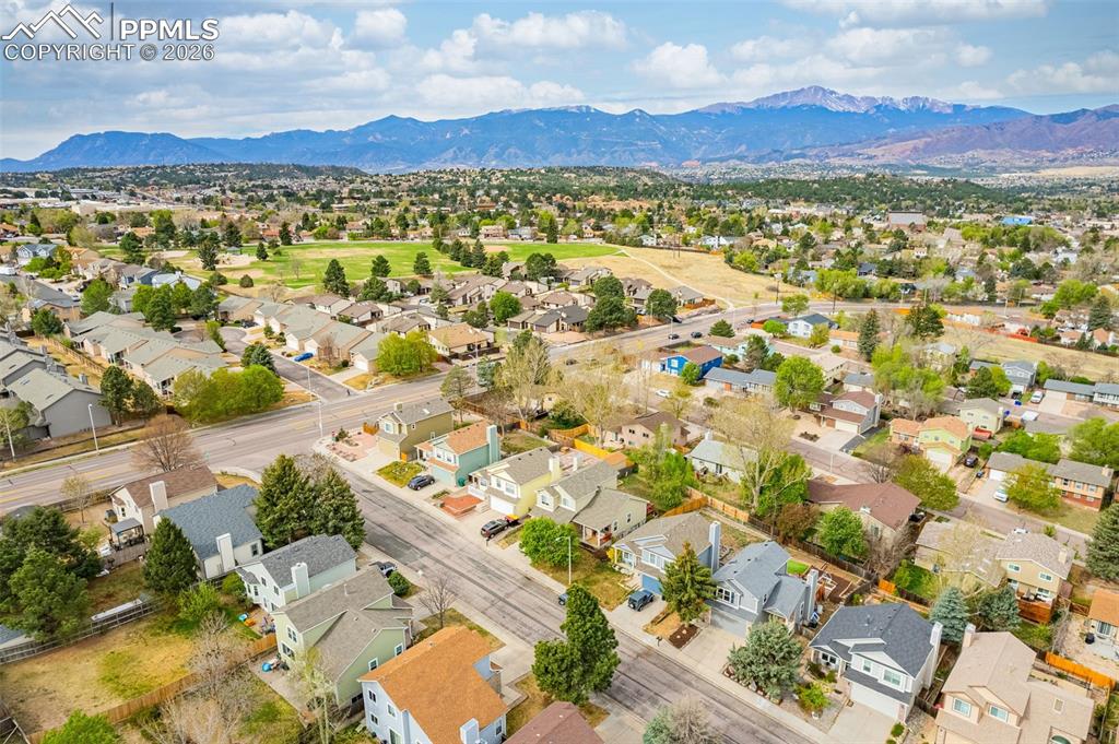 Image 37 of 41: Residential community featuring diverse home styles, paved streets, mature 
