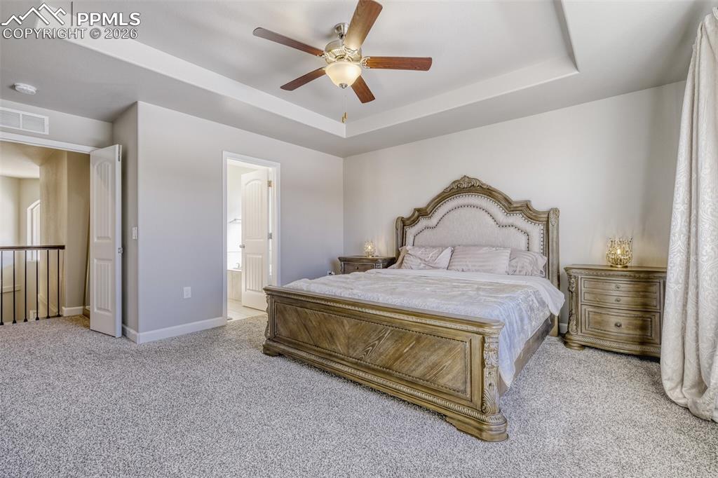 Image 17 of 42: French doors into primary bedroom