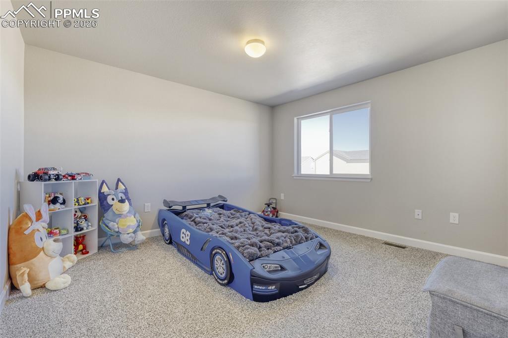 Image 25 of 42: upper level third bedroom