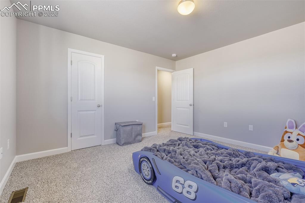 Image 26 of 42: upper level third bedroom