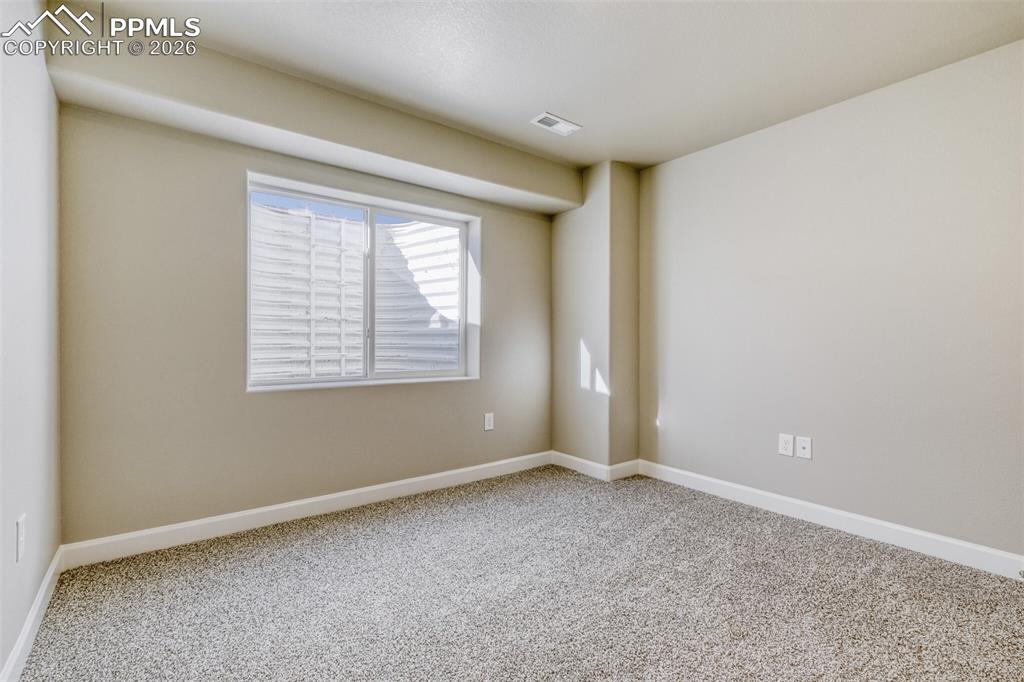 Image 35 of 42: basement bedroom (5th bedroom)