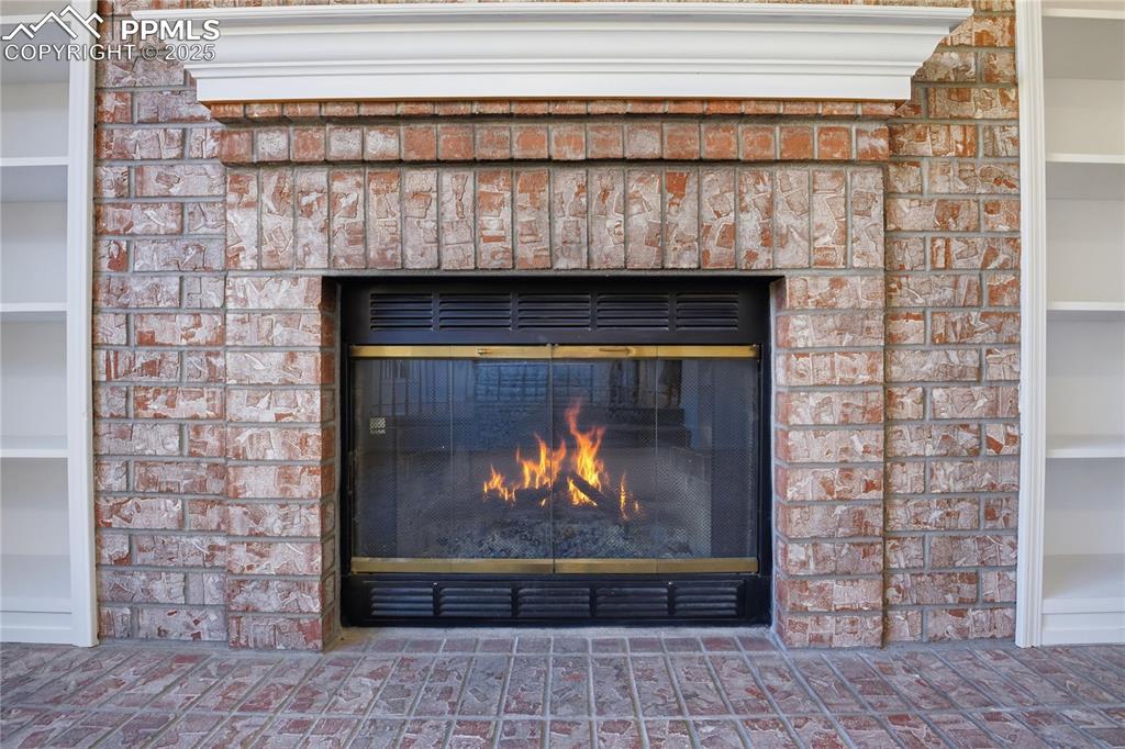 Image 40 of 42: Detailed view of a fireplace