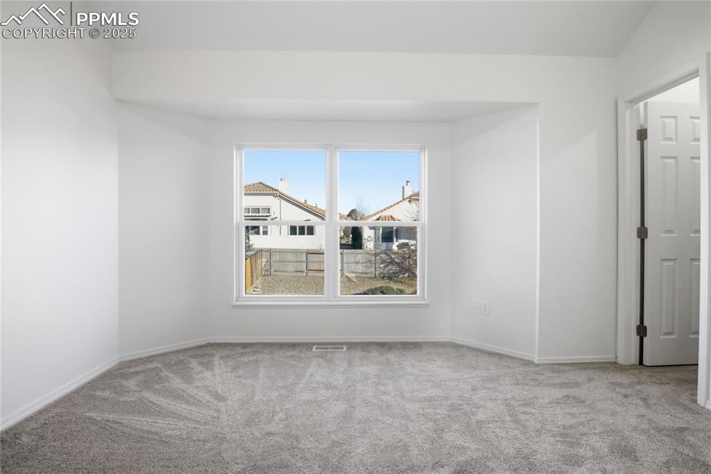 Image 6 of 42: Unfurnished room featuring carpet floors