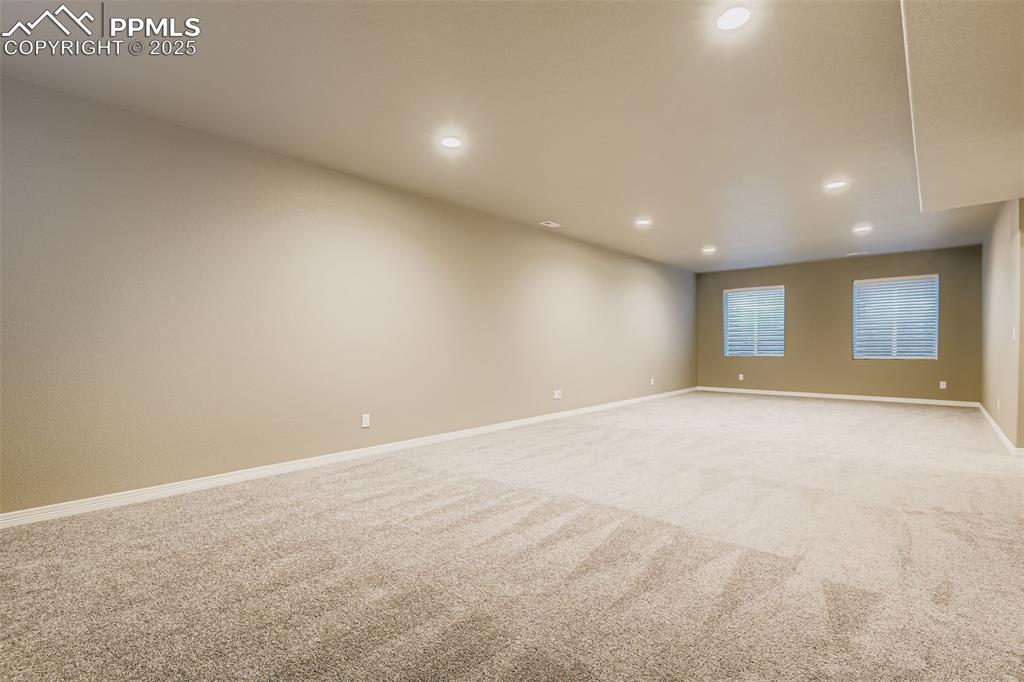 Image 23 of 28: Unfurnished room with carpet and recessed lighting