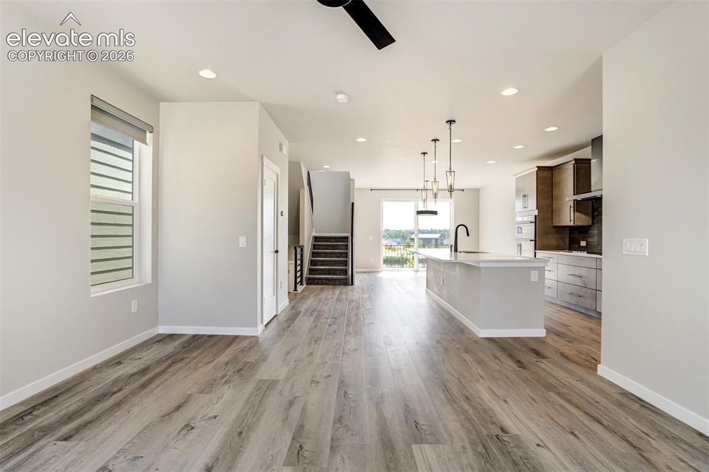 Image 9 of 50: Open concept kitchen, living room, and dining room