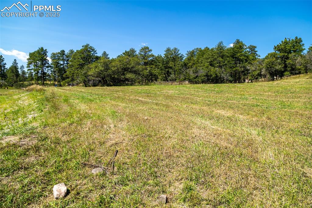 Image 18 of 18: View of yard with a view of countryside