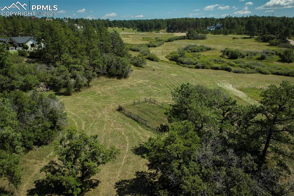 Image 4 of 18: View of property location with rural landscape and a heavily wooded area