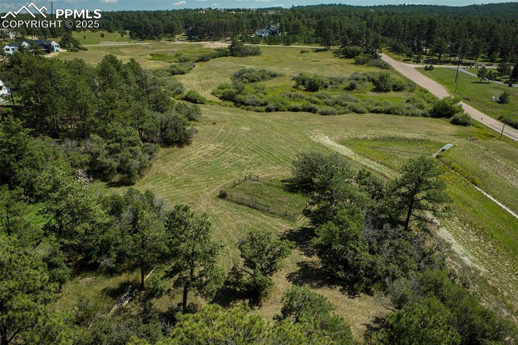 Image 5 of 18: Aerial view of property and surrounding area with rural landscape and a for