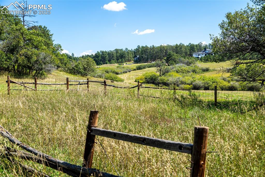 Image 8 of 18: View of yard featuring a view of rural / pastoral area