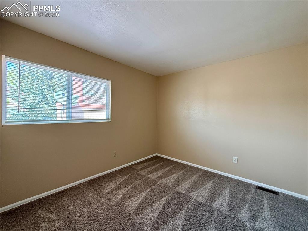 Image 12 of 18: Back Bedroom