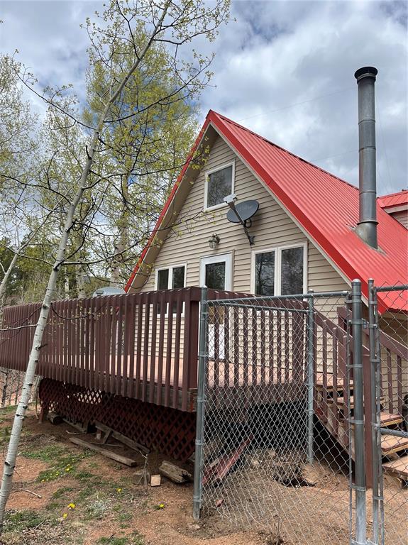 Caption: Trex Deck out the living room adds extra space for entertaining, enjoying the view and Beautiful Col