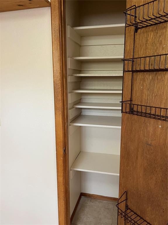 Image 8 of 10: Pantry closet adds some GREAT extra storage space