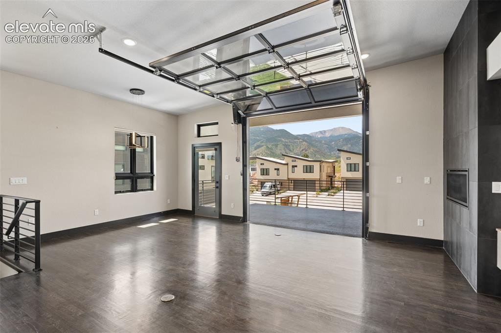Image 10 of 50: The Automatic Garage Door Invites the Outdoors In