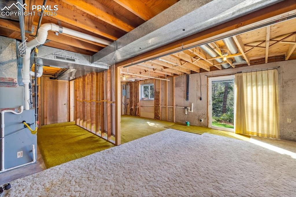 Image 25 of 38: Basement with heating unit