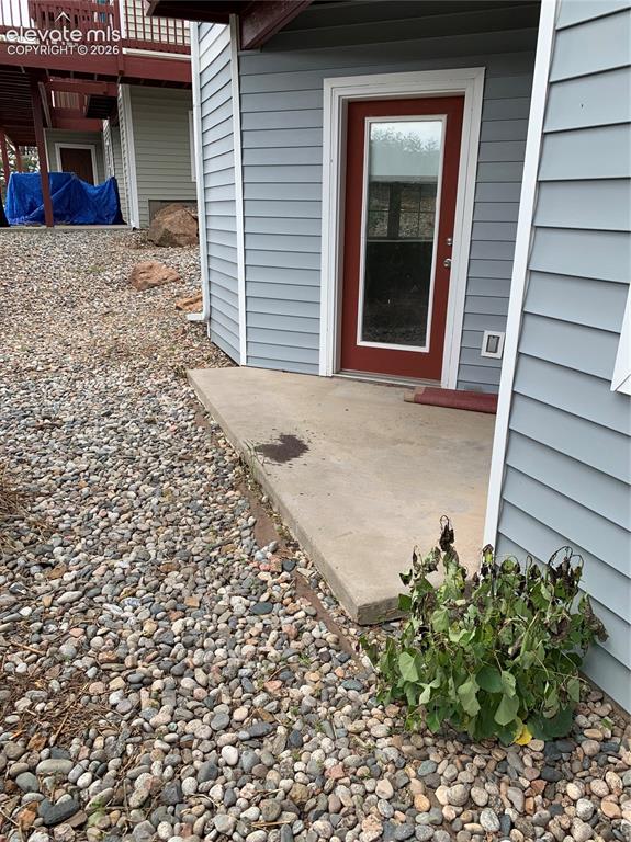 Caption: Nice little patio out front to enjoy - access from living room and bedroom.