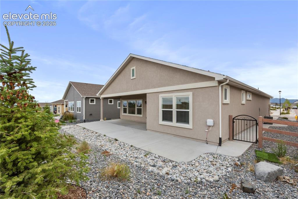 Image 21 of 22: Expanded concrete patio in backyard