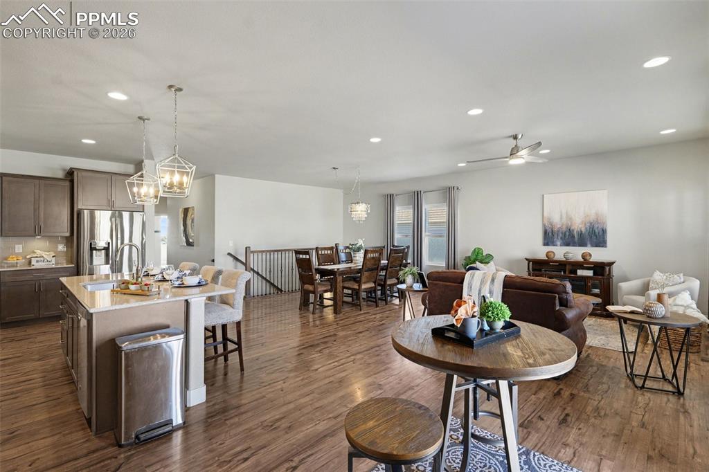 Image 16 of 37: The main-level living room features an open-concept design with luxurious f