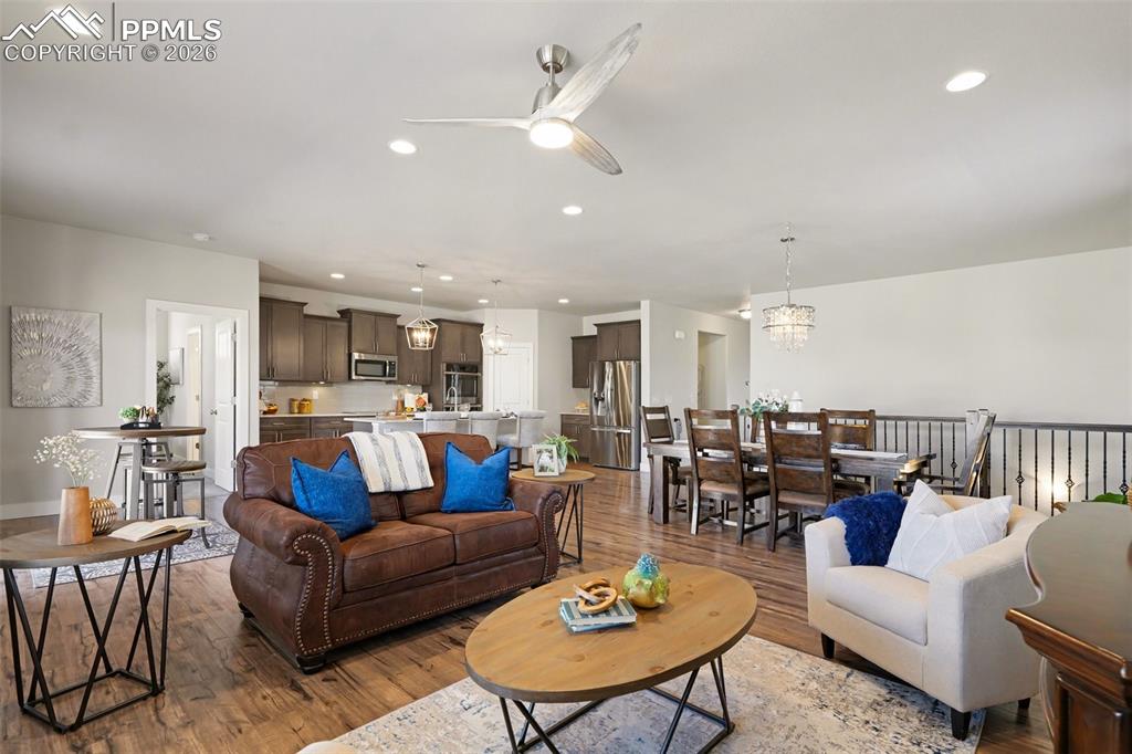 Image 17 of 37: The main-level living room showcases an open-concept design, creating a bri