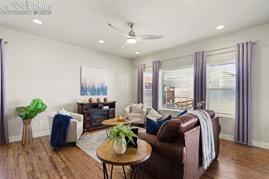 Image 20 of 37: The main-level living room features open concept layout.