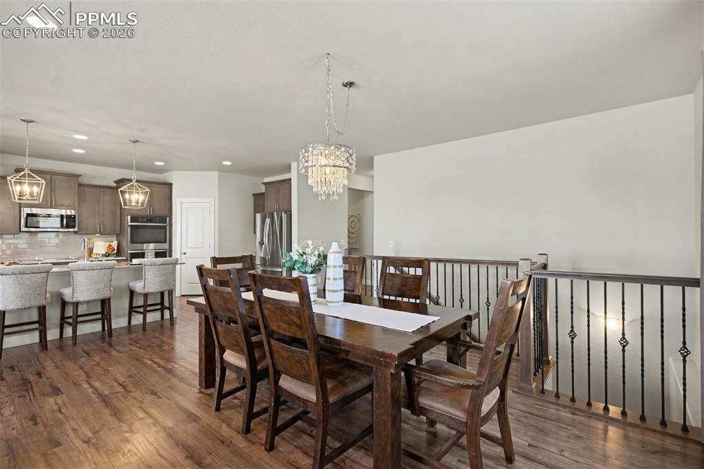 Image 22 of 37: The dining area is perfect for gatherings and seamlessly connects to both t