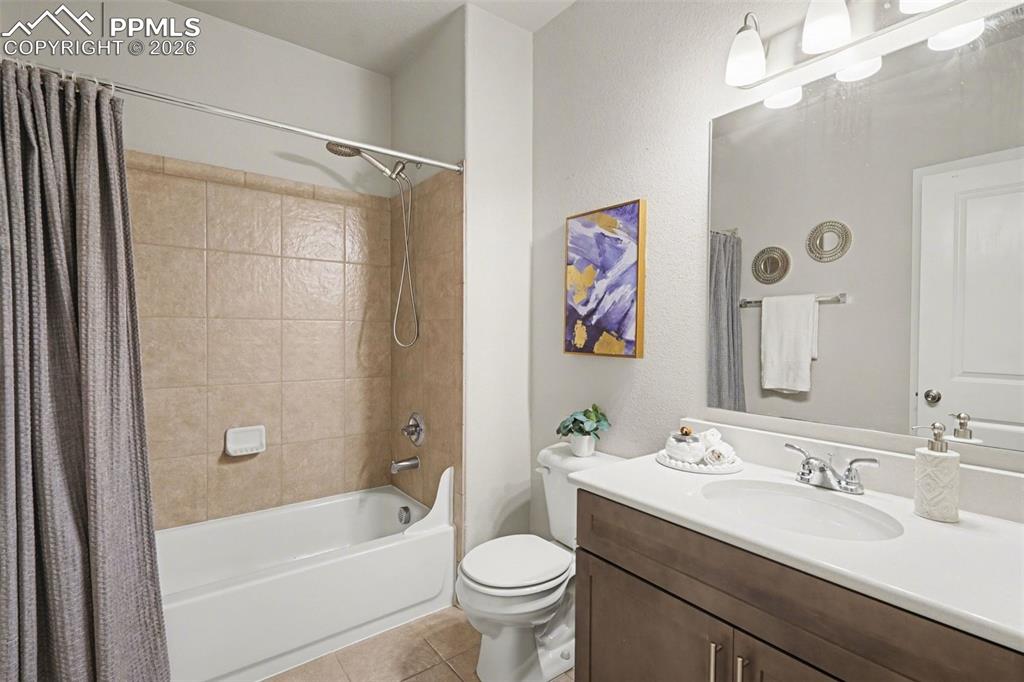Image 34 of 37: The basement includes a full bathroom, offering convenience and functionali