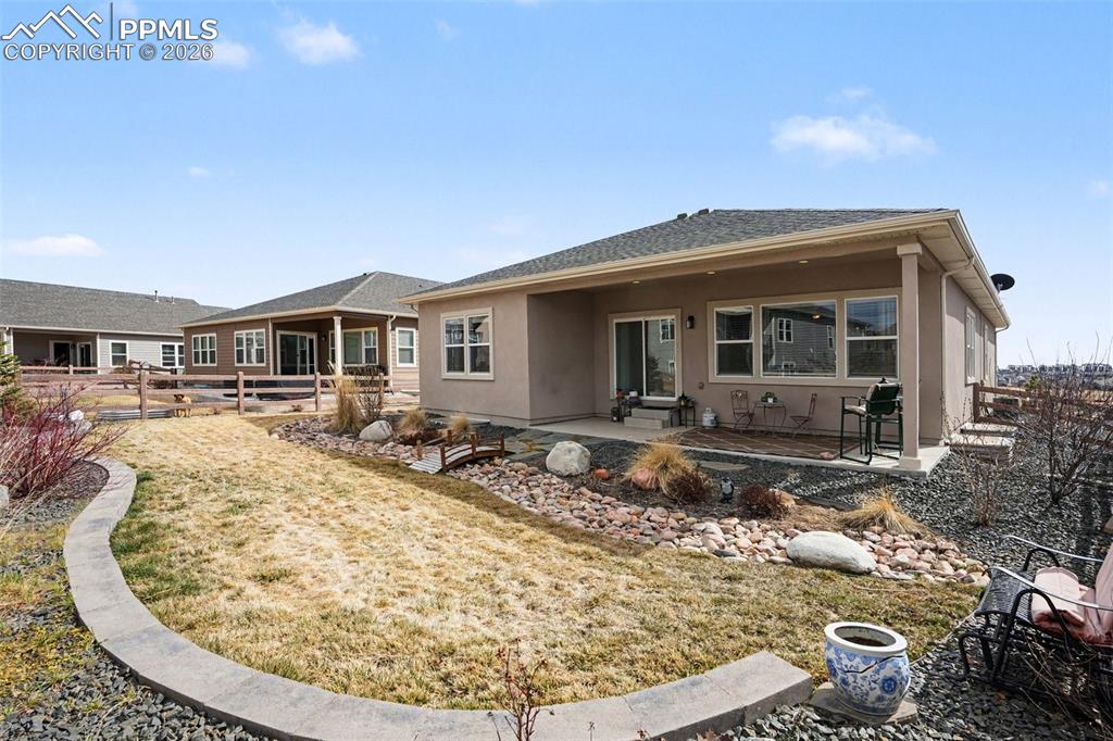 Image 36 of 37: A beautifully landscaped yard adds charm and visual appeal to the outdoor s