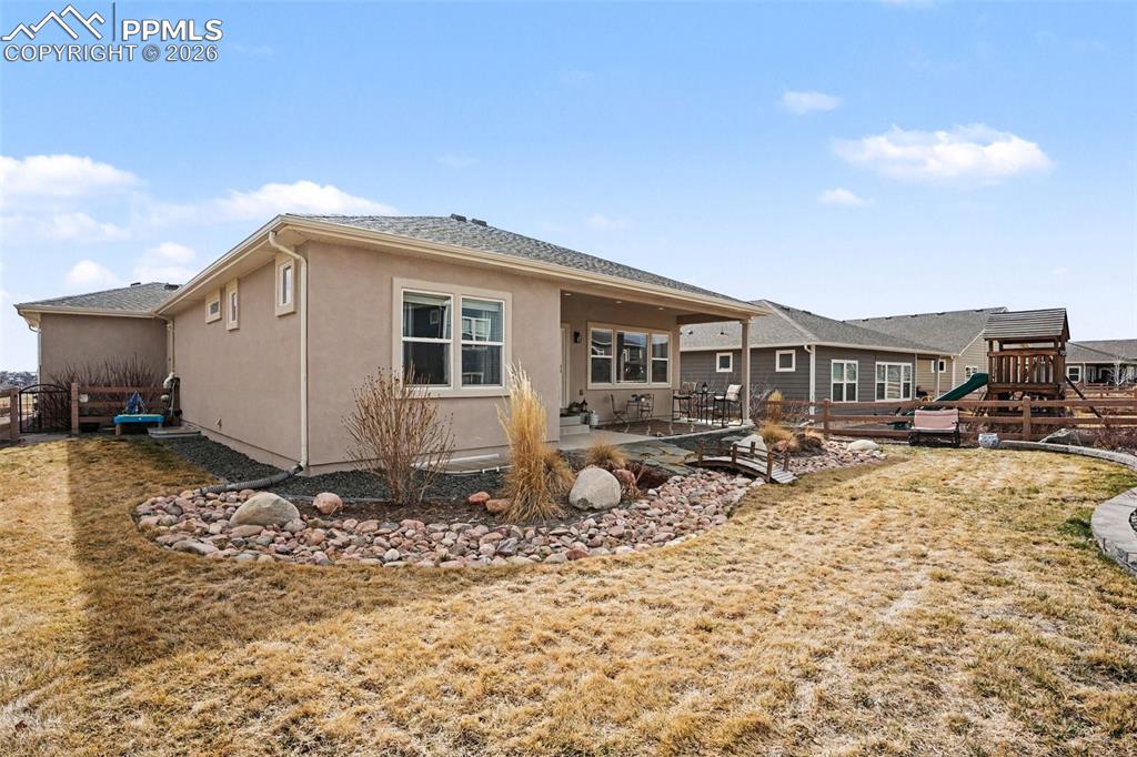 Image 37 of 37: The backyard -perfect setting for gatherings, outdoor dining, or enjoying C