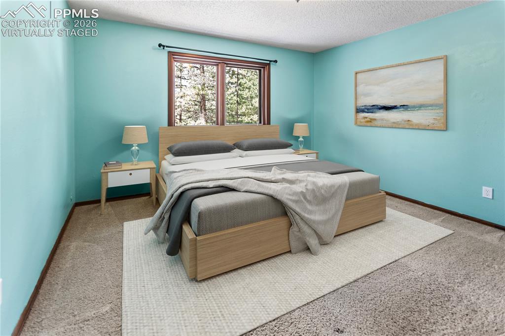 Image 12 of 34: Main Level Bed 2 - virtually staged