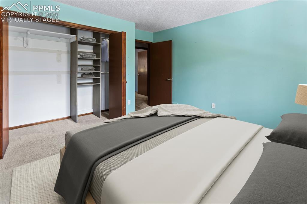 Image 13 of 34: Main Level Bed 2 - virtually staged