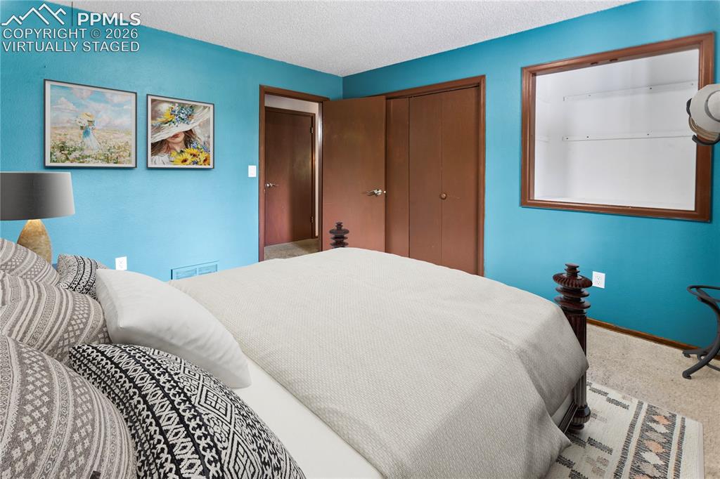 Image 16 of 34: Main Level Bed 3 - virtually staged